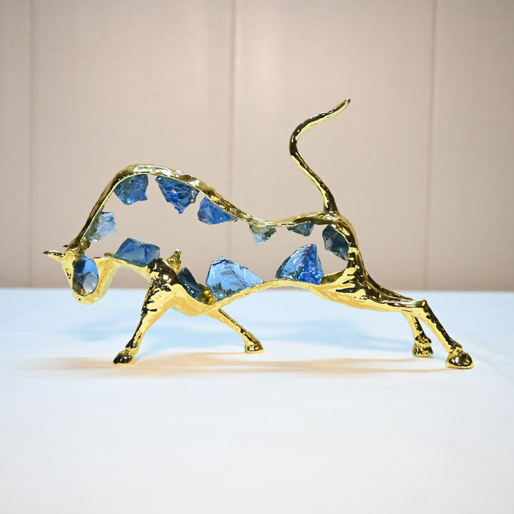 Golden bull showpiece with blue crystals for luxury home decor