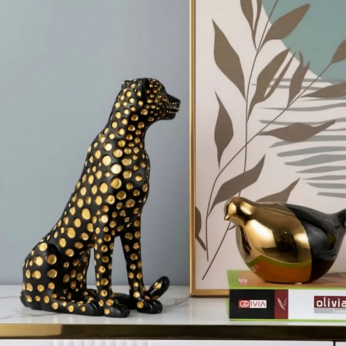 Modern black cheetah statue with golden accents for shelf decoration
