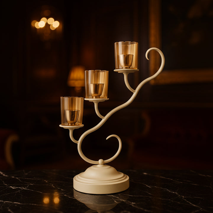 Elegant golden three-arm candle holder with glass votives, perfect for Diwali decoration and festive home decor by Divoma.