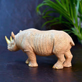 Handcrafted rhino décor piece with golden horns – modern home aesthetic