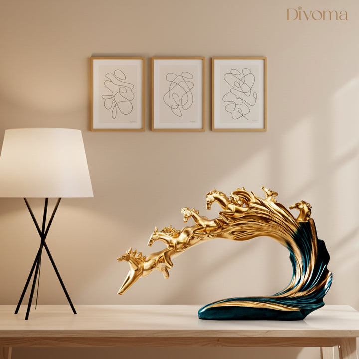 Golden running horses sculpture by Divoma, a luxury home decor showpiece for modern interiors.