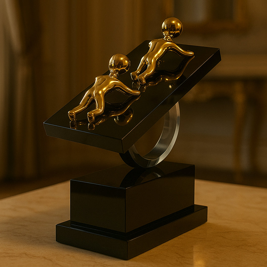 Modern golden human figurine showpiece on a black base, ideal for luxury home decor, office desk decoration, and contemporary interior design